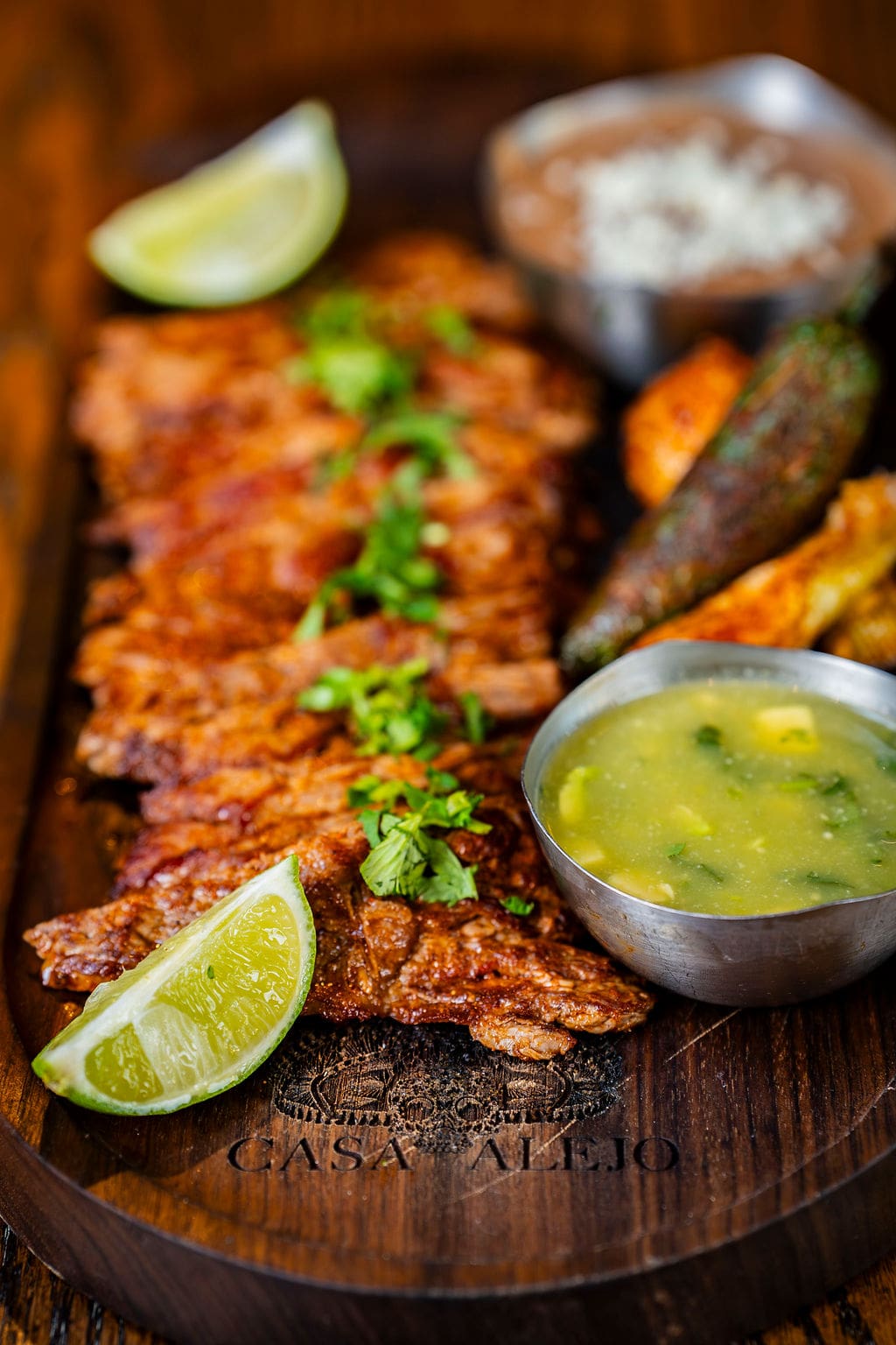 Grilled meat with lime and sides